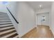 Hallway featuring wood-look tile flooring and an open staircase at 4656 Southern Valley Loop, Brooksville, FL 34601