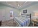 King-size bed, en-suite bathroom access, and relaxing sitting area at 921 Regal Manor Way, Sun City Center, FL 33573