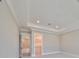 Primary bedroom with carpet, doors to other rooms, and crown molding at 3812 W Sevilla St, Tampa, FL 33629