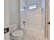 Clean bathroom with white subway tile and black accents at 3812 W Sevilla St, Tampa, FL 33629
