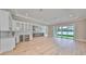 Bright living room with hardwood floors and sliding glass doors leading to backyard at 3812 W Sevilla St, Tampa, FL 33629