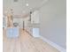 Modern kitchen with white cabinets and a large island at 3812 W Sevilla St, Tampa, FL 33629
