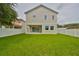 Large backyard with a two-story house and white fence at 3812 W Sevilla St, Tampa, FL 33629