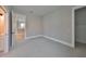 Bedroom with carpet, a closet and a door to the bathroom at 3812 W Sevilla St, Tampa, FL 33629