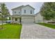 Two-story modern home with stone accents and paved driveway at 3812 W Sevilla St, Tampa, FL 33629
