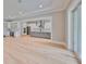 Open concept kitchen with island, stainless steel appliances, and hardwood floors at 3812 W Sevilla St, Tampa, FL 33629