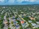 Aerial view of a house and neighborhood near the water at 3812 W Sevilla St, Tampa, FL 33629