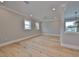 Large bonus room featuring hardwood floors and multiple windows at 3812 W Sevilla St, Tampa, FL 33629