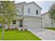 Two-story modern home with stone accents and paved driveway at 3812 W Sevilla St, Tampa, FL 33629