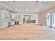 Spacious living area featuring hardwood floors and access to a private backyard at 3812 W Sevilla St, Tampa, FL 33629