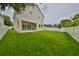 Spacious backyard with lush green grass and a large home at 3812 W Sevilla St, Tampa, FL 33629