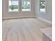Spacious living area with hardwood floors and large windows at 3812 W Sevilla St, Tampa, FL 33629