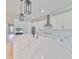 Modern kitchen with white cabinets, marble countertops, and stainless steel appliances at 3812 W Sevilla St, Tampa, FL 33629