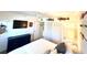 Bedroom with king-size bed, dresser, and large TV at 7530 Palm Island S Dr # 1413, Placida, FL 33946