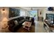 Living area featuring a sectional sofa, coastal art, and ocean views at 7530 Palm Island S Dr # 1413, Placida, FL 33946