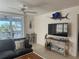 Relaxing living room with sectional sofa, large TV, and ocean view at 7530 Palm Island S Dr # 1413, Placida, FL 33946