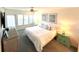 Bright bedroom with king-size bed and access to balcony at 7530 Palm Island S Dr # 1413, Placida, FL 33946
