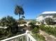View of resort with palm trees and beach access at 7530 Palm Island S Dr # 1413, Placida, FL 33946