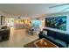 Spacious living room with comfortable sectional sofa, large TV, and ocean view at 7530 Palm Island S Dr # 1413, Placida, FL 33946