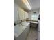 Laundry room with washer, dryer, and cabinets at 7530 Palm Island S Dr # 1413, Placida, FL 33946