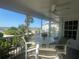 Screened porch overlooking ocean with outdoor seating at 7530 Palm Island S Dr # 1413, Placida, FL 33946