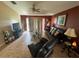 Relaxing living room with dark leather furniture and sliding glass doors at 13025 Early Run Ln, Riverview, FL 33578