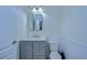 Small bathroom with gray vanity and marble countertop at 19462 Paddock View Dr, Tampa, FL 33647