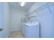 Laundry room with washer, dryer and shelving at 19462 Paddock View Dr, Tampa, FL 33647