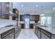 Modern kitchen with stainless steel appliances and granite countertops at 19462 Paddock View Dr, Tampa, FL 33647