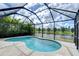 Screened-in pool with a tranquil view at 19462 Paddock View Dr, Tampa, FL 33647