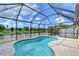 Enjoy this relaxing screened pool and patio area with lake views at 19462 Paddock View Dr, Tampa, FL 33647