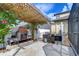Relaxing patio space with a stone fireplace and pergola at 19462 Paddock View Dr, Tampa, FL 33647