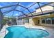 Inviting screened-in pool with a spacious patio at 19462 Paddock View Dr, Tampa, FL 33647