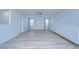 Spacious living room with wood-look floors and ceiling fan at 19462 Paddock View Dr, Tampa, FL 33647