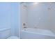 Clean bathroom with a bathtub and tiled walls at 19462 Paddock View Dr, Tampa, FL 33647