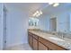 Double vanity bathroom with granite countertops and tiled floors at 19462 Paddock View Dr, Tampa, FL 33647