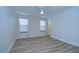 Bright bedroom with wood-look floors and ceiling fan at 19462 Paddock View Dr, Tampa, FL 33647