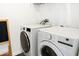 Bright laundry room, complete with washer and dryer at 927 Kelly Fern Loop, Ruskin, FL 33570