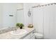 Clean bathroom with single sink vanity and shower/tub combo at 927 Kelly Fern Loop, Ruskin, FL 33570