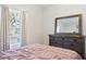 Bedroom with a dresser and queen-size bed at 927 Kelly Fern Loop, Ruskin, FL 33570