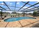 Large screened-in pool with plenty of space for lounging at 245 78Th N Ave, St Petersburg, FL 33702