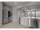Modern kitchen with stainless steel appliances and island at 6950 Towering Spruce Dr, Riverview, FL 33578