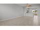 Spacious living room with tile floors and kitchen view at 6950 Towering Spruce Dr, Riverview, FL 33578