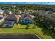Aerial view of a house with a pool and fenced backyard at 19433 Whispering Brook Dr, Tampa, FL 33647