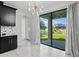 Bright kitchen with granite countertops and access to backyard at 19433 Whispering Brook Dr, Tampa, FL 33647