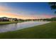 Serene lake view at sunset at 19433 Whispering Brook Dr, Tampa, FL 33647