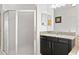 Bathroom features a walk-in shower and granite vanity at 19433 Whispering Brook Dr, Tampa, FL 33647