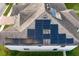 Aerial view of a house with solar panels on the roof at 19433 Whispering Brook Dr, Tampa, FL 33647