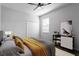 Guest bedroom with double doors and ceiling fan at 19433 Whispering Brook Dr, Tampa, FL 33647