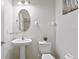 Small bathroom with pedestal sink and updated fixtures at 19433 Whispering Brook Dr, Tampa, FL 33647